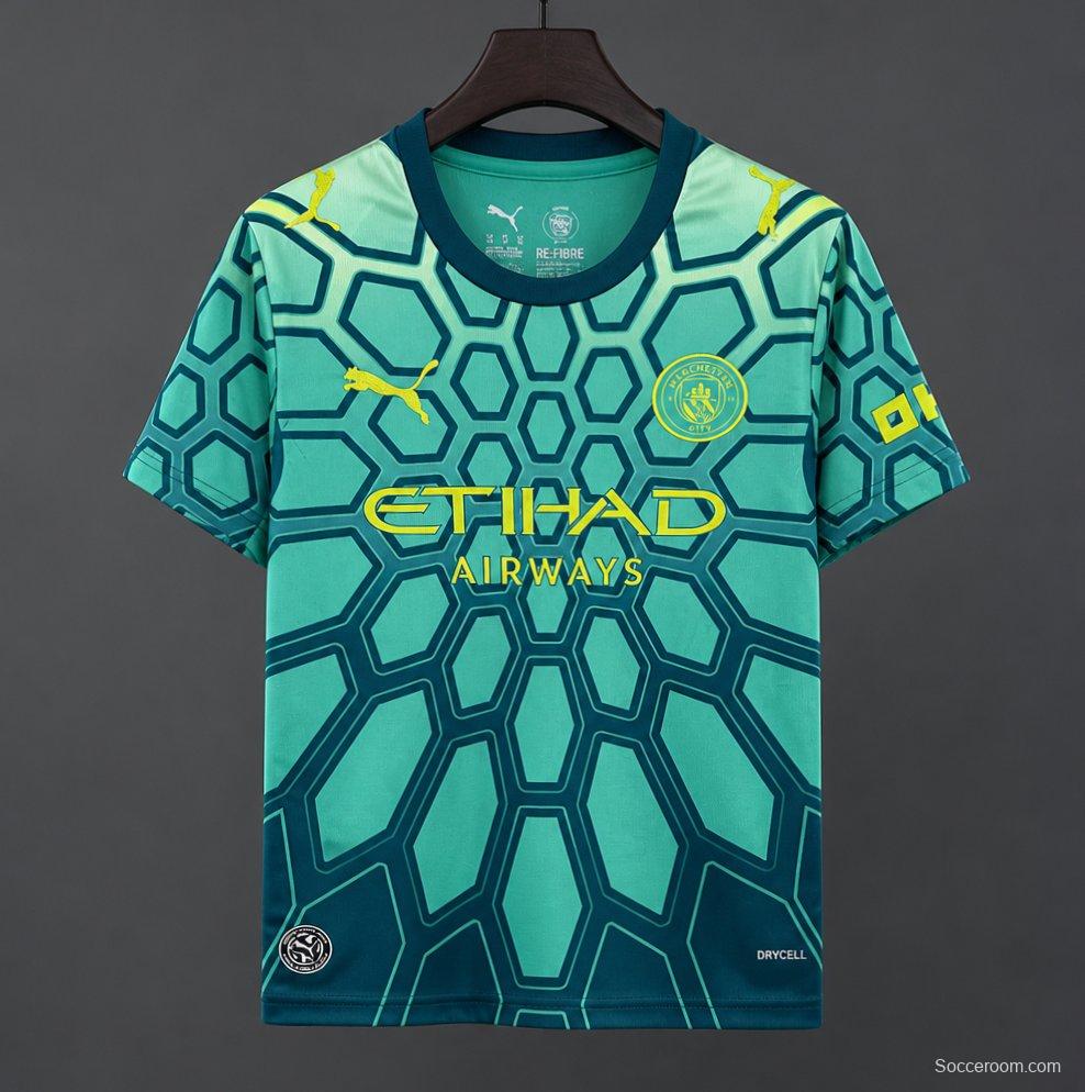 26/27 Manchester City Vibrant Green Goalkeeper Jersey With Dark Blue Geometric Pattern.